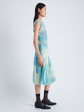 Side image of model wearing Zoe Dress in Printed Nylon Jersey in cyan