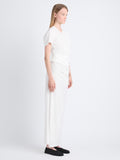 Side image of model in Sidney Dress In Silk Viscose in off white
