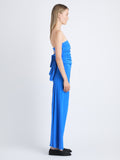 Side image of model wearing Odette Strapless Dress In Silk Viscose in cerulean