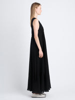 Side full length image of model wearing Lorna Dress In Viscose Mesh in BLACK