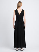 Back full length image of model wearing Lorna Dress In Viscose Mesh in BLACK