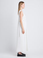 Side full length image of model wearing Lorna Dress In Viscose Mesh in OFF WHITE
