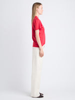 Side full length image of model wearing Talia V-Neck Top In Eco Cotton Jersey in RED