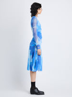 Side image of model wearing Amber Top In Printed Nylon Jersey in cerulean