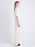 Side full length image of model wearing Addison Top In Washed Cotton Poplin in WHITE