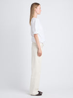 Side full length image of model wearing Addison Top In Washed Cotton Poplin in WHITE