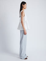 Side image of model wearing Casey Top in Matte Viscose Crepe in white