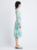 Side image of model in Judy Skirt In Printed Nylon Jersey in cyan