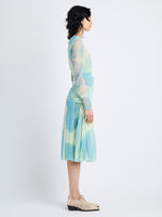 Side image of model in Judy Skirt In Printed Nylon Jersey in cyan