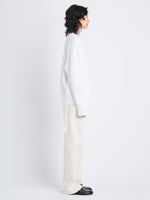 Side full length image of model wearing Amy Sweater In Viscose Boucle in WHITE