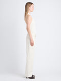 Side full length image of model wearing Gloria Top In Viscose Rib in EGGSHELL