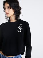 Detail image of model wearing Stella Sweater In Cashmere Jacquard in black