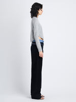 Side full length image of model wearing Stella Sweater In Cashmere Jacquard in GREY MELANGE