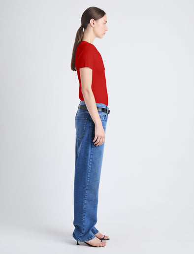 Side image of model wearing Sky Top In Matte Viscose Rib in red