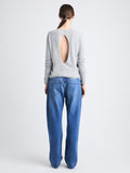 Back full length image of model wearing Tina Sweater In Cotton Silk in LIGHT GREY MELANGE