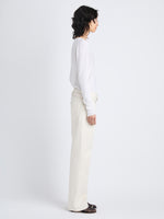 Side image of model in Tina Sweater In Cotton Silk in white