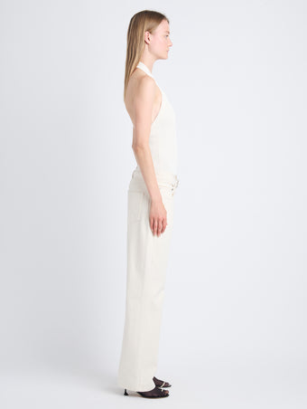 Side image of model wearing Ellsworth Jean in ecru