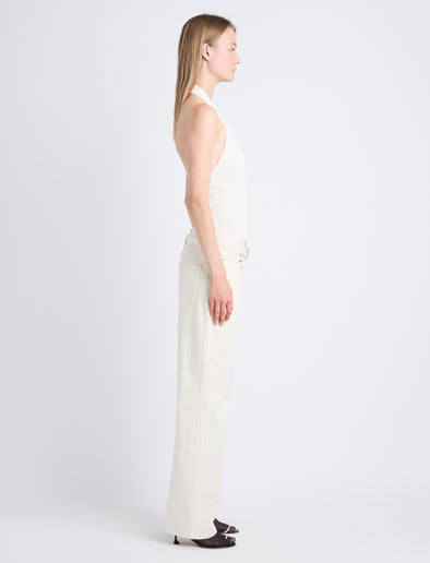 Side image of model wearing Ellsworth Jean in ecru