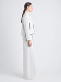 Side full length image of model wearing Wiley Jacket In Cotton Linen in ECRU