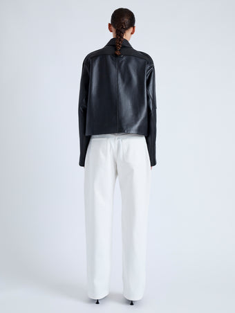 Back image of model wearing Dylan Jacket in Glossy Leather in black