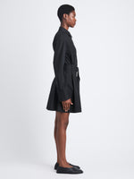 Side full length image of model wearing Viola Dress In Compact Poplin in BLACK