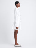 Side full length image of model wearing Viola Dress In Compact Poplin in WHITE