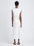 Back full length image of model wearing Lynn Dress In Eco Cotton Jersey in WHITE