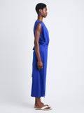 Side full length image of model wearing Lynn Dress In Eco Cotton Jersey in COBALT