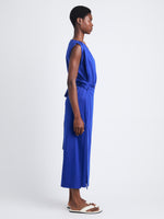 Side full length image of model wearing Lynn Dress In Eco Cotton Jersey in COBALT