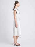 Side full length image of model wearing Monir Dress In Cotton Linen in ECRU