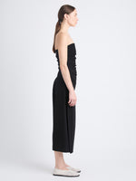 Side image of model wearing Shira Strapless Dress In Matte Viscose Crepe in black