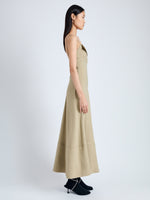 Side full length image of model wearing Ruby Dress in Eco Stretch Linen Viscose in BRONZE