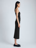 Side image of model wearing Blaire Dress in Viscose Jersey in black