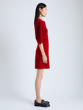 Side image of model wearing Goldie Dress in Matte Viscose Crepe in red