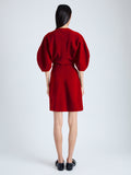 Back image of model wearing Goldie Dress in Matte Viscose Crepe in red