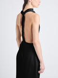 Detail image of model wearing Selena Twist Back Dress in Matte Viscose Crepe in black