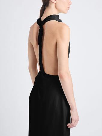 Detail image of model wearing Selena Twist Back Dress in Matte Viscose Crepe in black