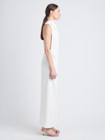 Side image of model wearing Selena Twist Back Dress in Matte Viscose Crepe in white