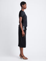 Side image of model wearing Maren Top in Eco Cotton Jersey in black