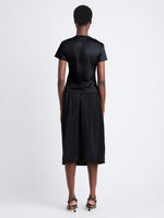 Back image of model wearing Maren Top in Eco Cotton Jersey in black