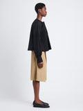 Side full length image of model wearing Monica Top In Compact Poplin in BLACK