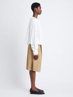 Side full length image of model wearing Monica Top In Compact Poplin in WHITE