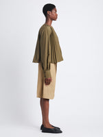 Side full length image of model wearing Monica Top In Compact Poplin in WOOD
