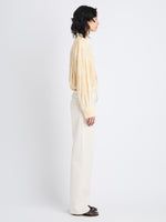 Side full length image of model wearing Norman Top In Printed Viscose Crepe in YELLOW MULTI