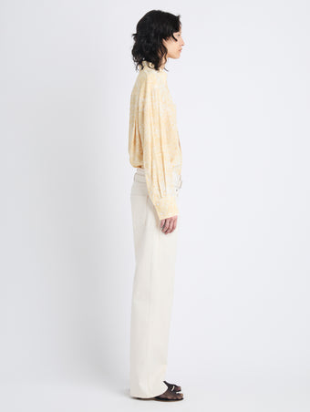 Side full length image of model wearing Norman Top In Printed Viscose Crepe in YELLOW MULTI
