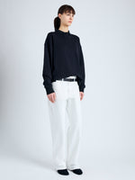 Side full length image of model wearing Brooks Polo in Cotton Terry Jersey in BLACK