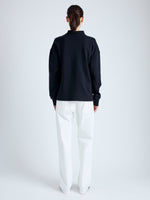 Back full length image of model wearing Brooks Polo in Cotton Terry Jersey in BLACK