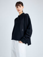 Detail image of model wearing Brooks Polo in Cotton Terry Jersey in BLACK