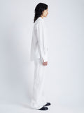 Side full length image of model wearing Allen Shirt in Crinkled Cotton Gabardine in WHITE