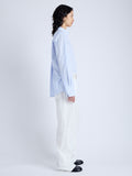 Side full length image of model wearing Allen Shirt in Crinkled Cotton Gabardine in SKY BLUE